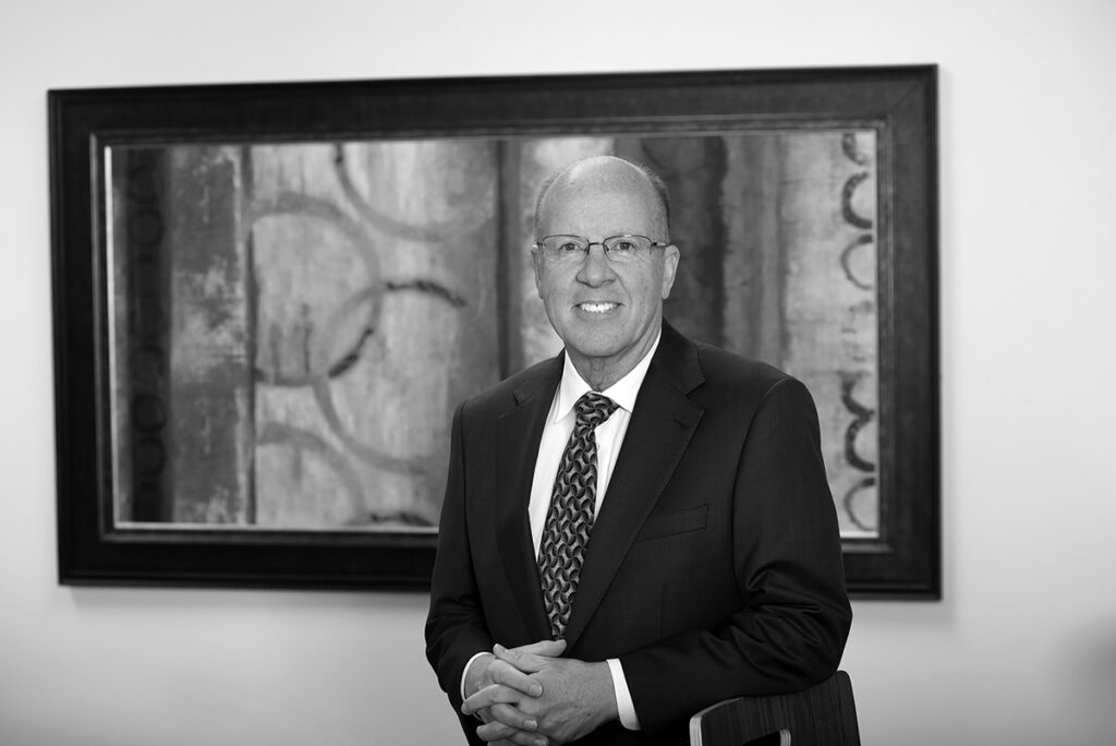 St. Louis corporate lawyer black and white in front of artwork